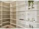 Spacious walk-in closet with custom shelving for optimal organization and stylish storage solutions at 7974 1St S Ave, St Petersburg, FL 33707