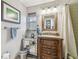 Charming bathroom with decorative vanity, mirror cabinet, and tiled shower at 854 Harbor Is, Clearwater, FL 33767