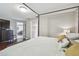 Comfortable bedroom with a canopy bed, dark wood floors, and a dresser with TV at 854 Harbor Is, Clearwater, FL 33767