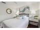 Inviting bedroom featuring a cozy bed, stylish decor, and bedside tables at 854 Harbor Is, Clearwater, FL 33767