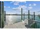 Scenic view from the dock with white chairs, offering a tranquil spot to enjoy the waterfront and beautiful surroundings at 854 Harbor Is, Clearwater, FL 33767