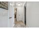 Hallway displaying doors leading to other rooms, neutral tile flooring at 854 Harbor Is, Clearwater, FL 33767
