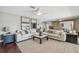 Spacious living room with large sectional sofa, area rug, and stylish decor at 854 Harbor Is, Clearwater, FL 33767