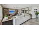 Comfortable living room with stylish decor, including a plush sofa, shelving, and a large television at 854 Harbor Is, Clearwater, FL 33767