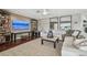 Bright living room with large sofa, open shelving, and an area rug at 854 Harbor Is, Clearwater, FL 33767
