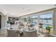 Bright living room with water views, featuring comfortable seating and an open layout, ideal for entertaining at 854 Harbor Is, Clearwater, FL 33767