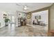 An open concept living space with a bar, dining room, front door, and tile flooring at 854 Harbor Is, Clearwater, FL 33767