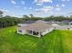 Aerial view of the property showcasing the house, backyard, and neighborhood at 8960 Windlass Cv, Parrish, FL 34219