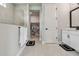 Bathroom with walk-in shower, storage and modern vanity at 8960 Windlass Cv, Parrish, FL 34219