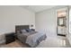 Cozy bedroom with neutral walls, carpeted floors, and ensuite bathroom at 8960 Windlass Cv, Parrish, FL 34219