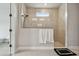 Beautifully tiled shower with glass enclosure and sleek fixtures at 8960 Windlass Cv, Parrish, FL 34219