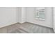 Empty bedroom featuring carpet and natural light from the window at 10520 Hidden Banks Gln, Parrish, FL 34219
