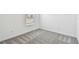 Clean and neutral bedroom featuring new carpeting, fresh paint, and ample natural light from the window at 10520 Hidden Banks Gln, Parrish, FL 34219