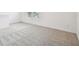 Bright bedroom with neutral carpet and natural light from the double windows at 10520 Hidden Banks Gln, Parrish, FL 34219