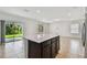Spacious kitchen island perfect for meal prep, with a sliding door to the yard at 10520 Hidden Banks Gln, Parrish, FL 34219