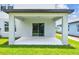 Covered patio with a view of the backyard, offering a space for outdoor entertaining at 10520 Hidden Banks Gln, Parrish, FL 34219