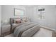 Serene bedroom with neutral colors, a large window, and modern furniture at 10628 Bahama Woodstar Ct, Riverview, FL 33579