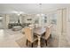 Open concept living and dining area with natural light, neutral tones, and stylish furniture at 10628 Bahama Woodstar Ct, Riverview, FL 33579