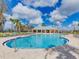 Community pool featuring clear blue water, surrounding lounge chairs, and ample space for relaxation at 10628 Bahama Woodstar Ct, Riverview, FL 33579