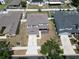 Aerial view of two-story home with well-kept lawn and landscaping at 11136 Hartford Fern Dr, Riverview, FL 33569
