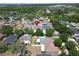 An aerial view of a property with a private backyard, mature trees, and close proximity to local amenities at 11136 Hartford Fern Dr, Riverview, FL 33569