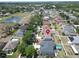 An aerial view of a home with a well-manicured lawn in a quiet, residential neighborhood at 11136 Hartford Fern Dr, Riverview, FL 33569