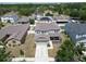 Aerial shot showcasing a two-story house with a spacious front yard and well-maintained landscaping at 11136 Hartford Fern Dr, Riverview, FL 33569