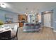Modern kitchen with wood cabinets, stainless steel appliances, and breakfast bar seating at 11136 Hartford Fern Dr, Riverview, FL 33569