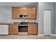 Well-equipped kitchen with wood cabinets, stainless steel appliances, granite counters, and a stylish mosaic backsplash at 11136 Hartford Fern Dr, Riverview, FL 33569