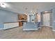 Well-lit kitchen with wood cabinets, a breakfast bar, and modern pendant lighting at 11136 Hartford Fern Dr, Riverview, FL 33569