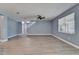 Bright living room with wood-look floors, neutral walls, and a ceiling fan at 11136 Hartford Fern Dr, Riverview, FL 33569