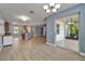 Spacious living area with sliding glass doors to outside patio, new floors, and neutral paint colors at 11136 Hartford Fern Dr, Riverview, FL 33569