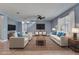Inviting living room with neutral walls, light wood floors, and modern decor at 11136 Hartford Fern Dr, Riverview, FL 33569