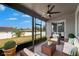 The screened in patio offers furniture and a lovely view of the backyard at 11136 Hartford Fern Dr, Riverview, FL 33569