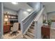 Staircase with wood steps, white handrails, and reading nook with desk at 11136 Hartford Fern Dr, Riverview, FL 33569
