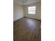 Simple bedroom offers a serene escape and comfortable laminate flooring at 11411 Pike Ct # 6, New Port Richey, FL 34654
