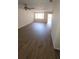 Bright living room with a ceiling fan and access to the outdoor patio at 11411 Pike Ct # 6, New Port Richey, FL 34654