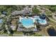 Aerial view of the community pool, hot tub and water slide on a sunny day at 11607 Meridian Point Dr, Tampa, FL 33626