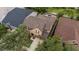 An aerial view of a home and community showcasing the pool, landscaping, and neighboring properties at 11607 Meridian Point Dr, Tampa, FL 33626
