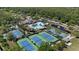 Aerial view of community amenities including tennis courts, pools, ponds, and recreational areas at 11607 Meridian Point Dr, Tampa, FL 33626