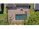 Aerial view of a private pool, patio, and manicured landscaping at 11607 Meridian Point Dr, Tampa, FL 33626