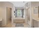 Bright bathroom featuring a soaking tub, walk-in shower, and tile flooring at 11607 Meridian Point Dr, Tampa, FL 33626