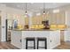 A kitchen featuring granite countertops, stainless steel appliances, a breakfast bar and pendant lights at 11607 Meridian Point Dr, Tampa, FL 33626