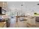 Spacious eat-in kitchen featuring granite countertops, stainless steel appliances, and a central island at 11607 Meridian Point Dr, Tampa, FL 33626