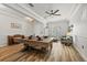 Open-concept living space with wood floors, a dining table, piano, and view to seating area at 11607 Meridian Point Dr, Tampa, FL 33626