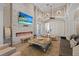 Relaxing lounge area featuring a stone fireplace, comfortable seating, and a TV at 11607 Meridian Point Dr, Tampa, FL 33626