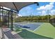 Outdoor pickleball court offering a fun recreational amenity with nearby sunshade at 11607 Meridian Point Dr, Tampa, FL 33626