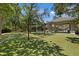 A playground with swings and climbing structures, with shaded picnic area at 11607 Meridian Point Dr, Tampa, FL 33626