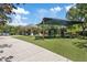 A well maintained playground with soft turf, climbing structures, and shaded pavilion at 11607 Meridian Point Dr, Tampa, FL 33626