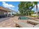 A backyard pool and seating, perfect for warm days and relaxation at 11607 Meridian Point Dr, Tampa, FL 33626
